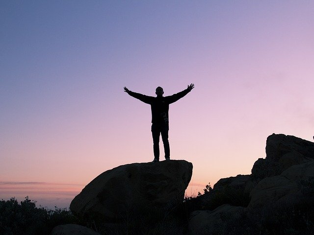 Person Standing on a Rock